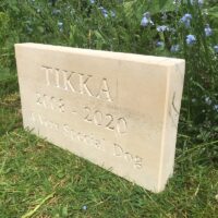 Limestone Pet Memorial Tablet for Tikka in the Garden side